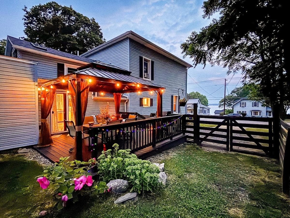 Evenings at Cayuga Breeze. String lights, cozy conversations, and that subtle lake breeze drifting through the gate. Your perfect escape starts here.