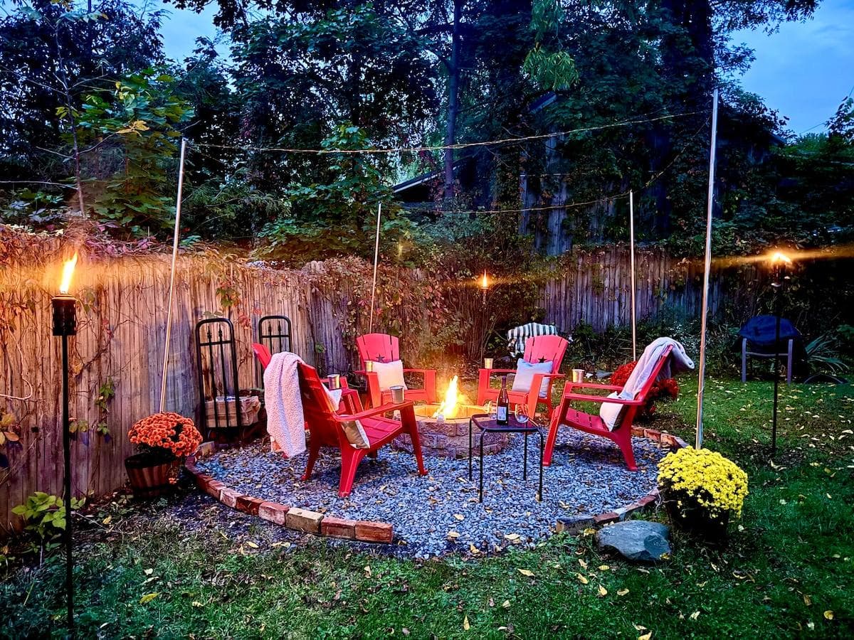 Gather ‘round a fire pit lined with refurbished 1820s chimney bricks! Cozy up with blankets, string lights, and s’mores-ready vibes in a fenced backyard perfect for pets, kids, or winding down under the stars. Pure FLX charm.